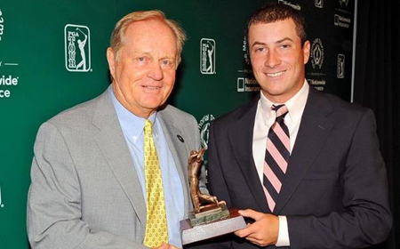Guilford's Noah Ratner receives his award from Jack Nicklaus at The Memorial golf tournament at Muirfield Village Golf Club in Dublin, Ohio.